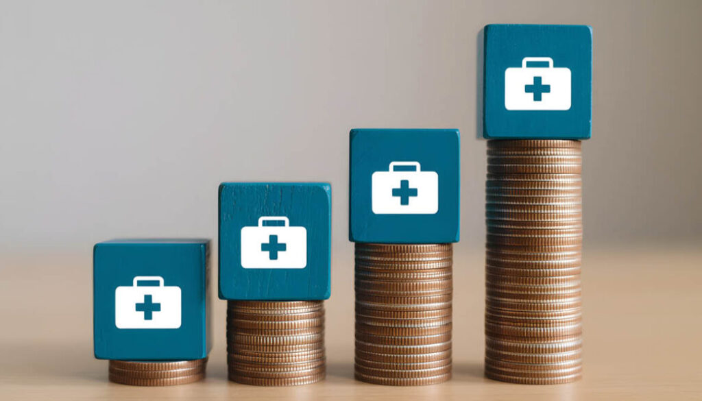 Stacked coins with healthcare icons representing rising employee health plan costs over time