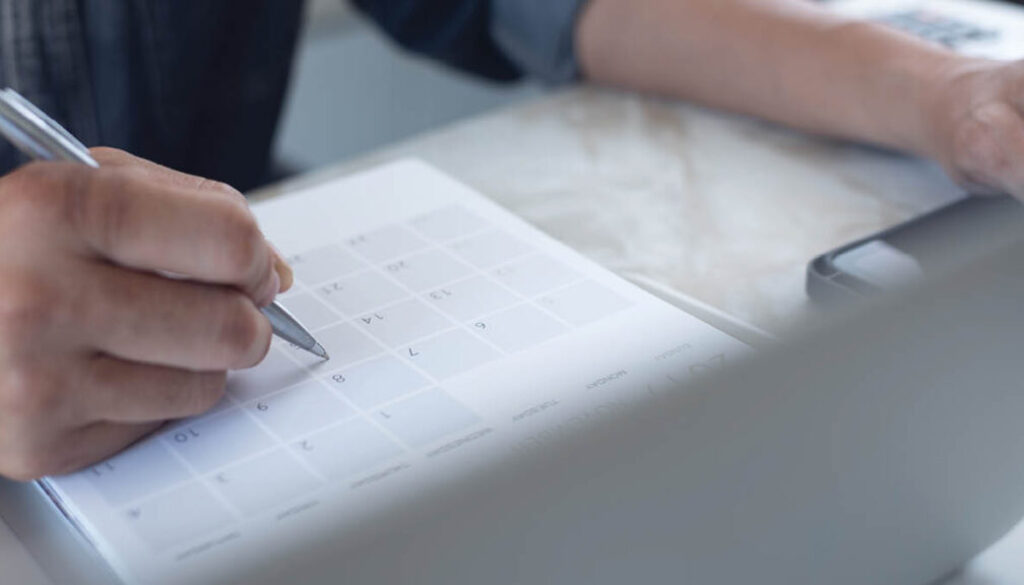 HR professional reviewing employee benefits strategy and cost trends during Q2 planning